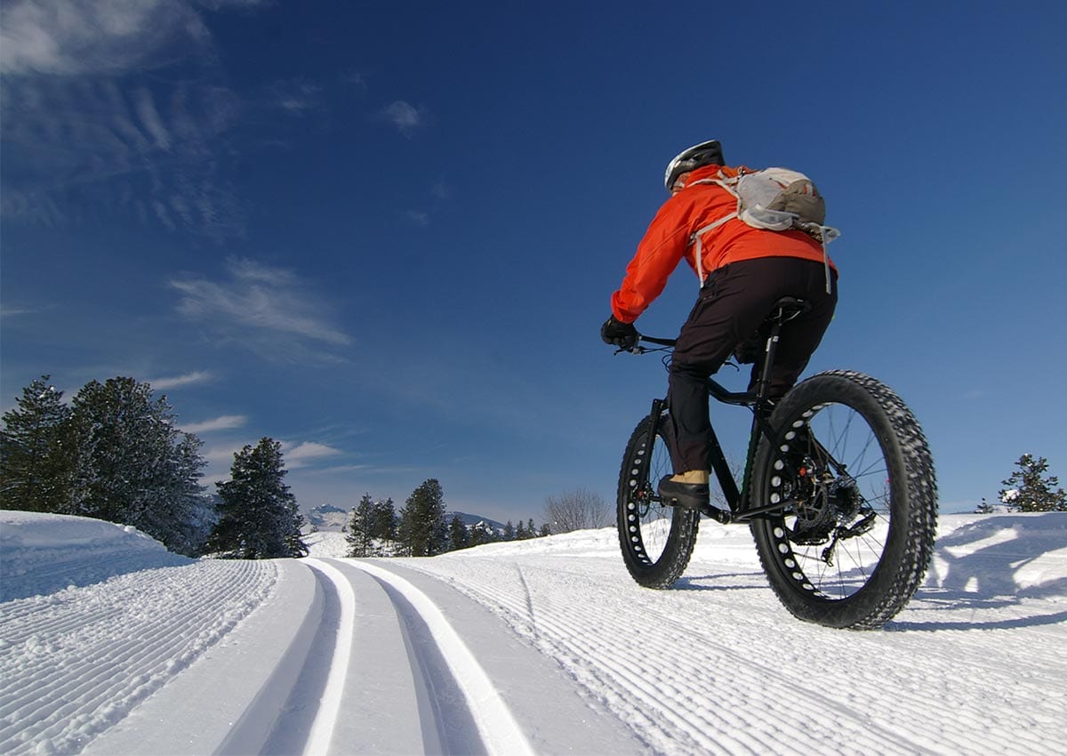 Biker Riding on Groomed Snow